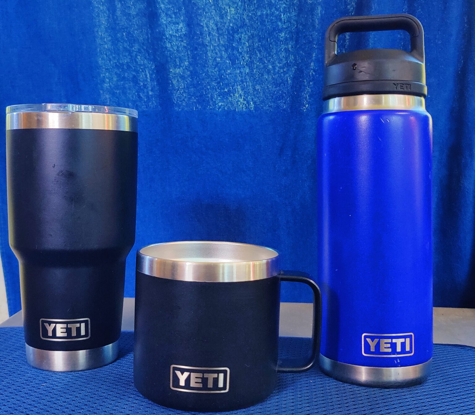 YETI Rambler trio — tumbler, stackable mug, and 26oz bottle.