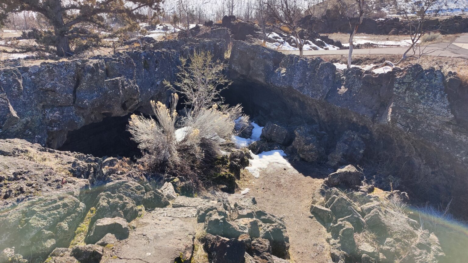 Stone steps descending into the shadowed entrance of Valentine Cave.